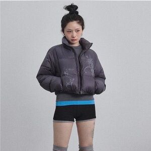 Purple puffer jacket with a touch of grunge style